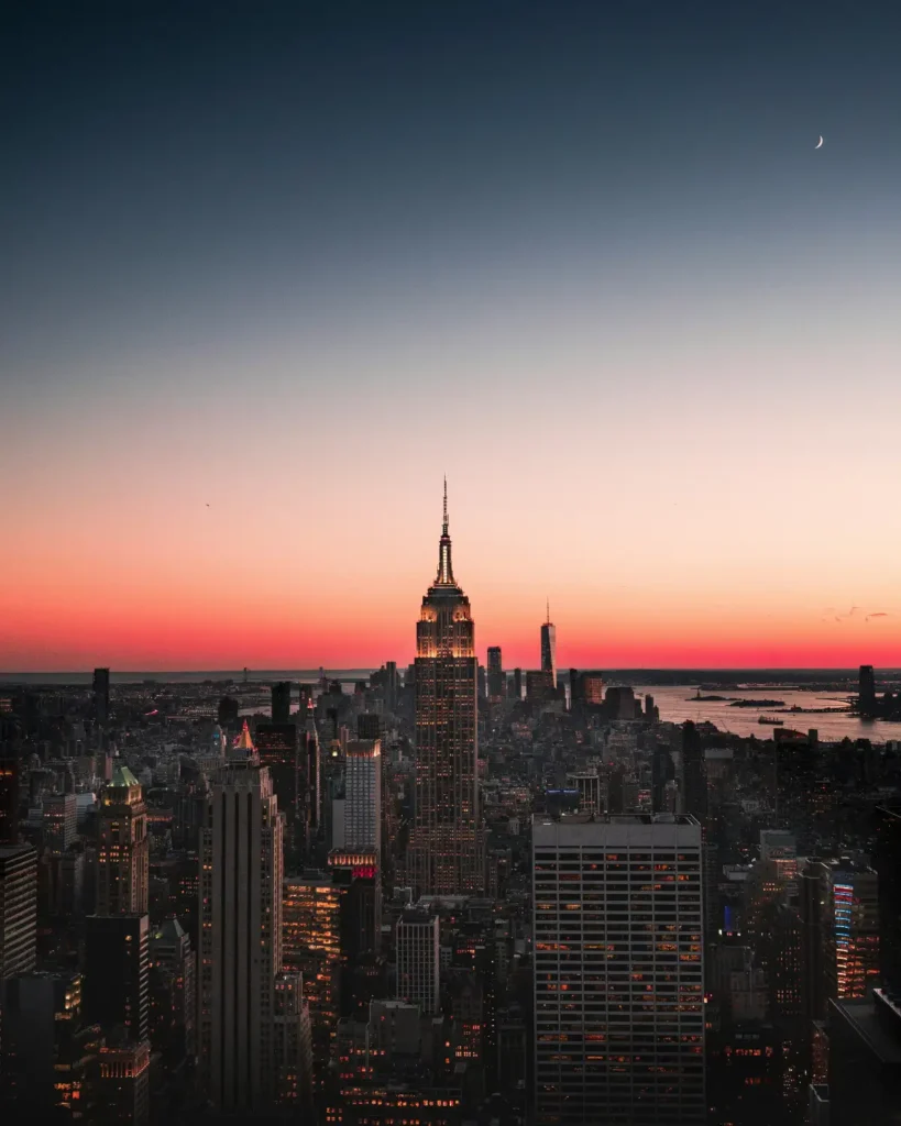 Things to Do in NYC 1 Manhattan skyline at sunset, seen from a viewing deck — one of the best things to do in NYC