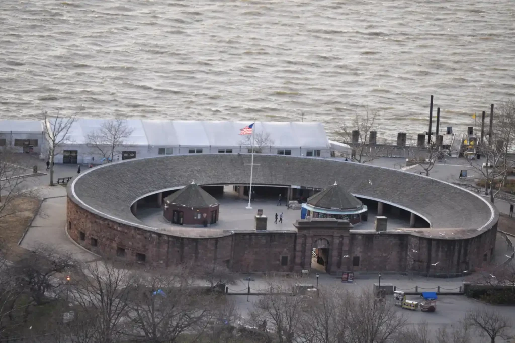 Statue of Liberty and Ellis Island: Tickets, Ferries, and What the Guides Miss 4 Castle Clinton in The Battery, where Statue of Liberty ferry tickets are sold, with the harbour behind
