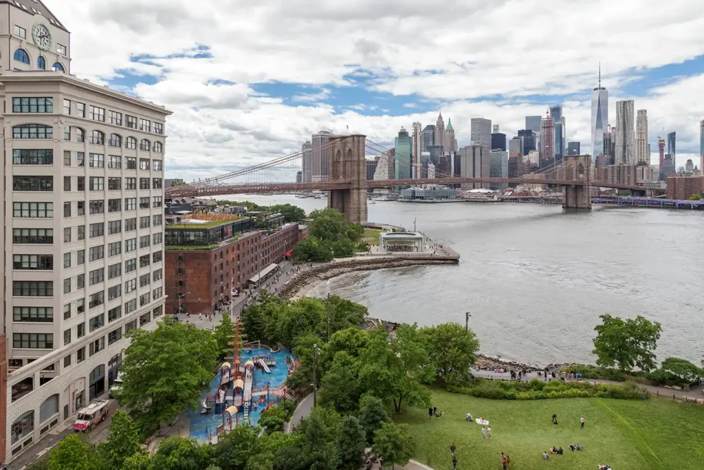 Brooklyn Bridge Park: Every Pier, What's Free, and When Things Are Actually Open 1 Brooklyn Bridge Park waterfront with the Main Street playground, Empire Stores and the Lower Manhattan skyline