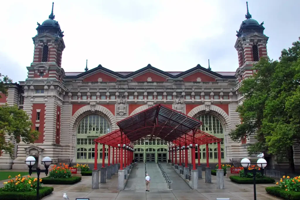 Statue of Liberty and Ellis Island: Tickets, Ferries, and What the Guides Miss 3 The entrance to the Main Immigration Building at Ellis Island, with its four domed towers and red canopy