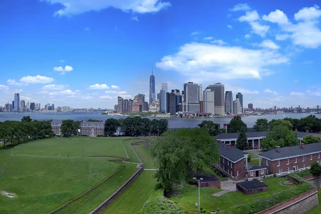 Governors Island: Free Ferries, Fort Hours, and the Rules Nobody Prints 1 Governors Island seen from Fort Jay, with the historic district in front and the Lower Manhattan skyline across the harbour