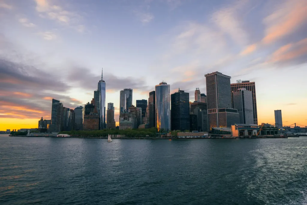 Staten Island Ferry: The Free Ride Past the Statue of Liberty 2 The Lower Manhattan skyline at sunset seen across the water from New York Harbor