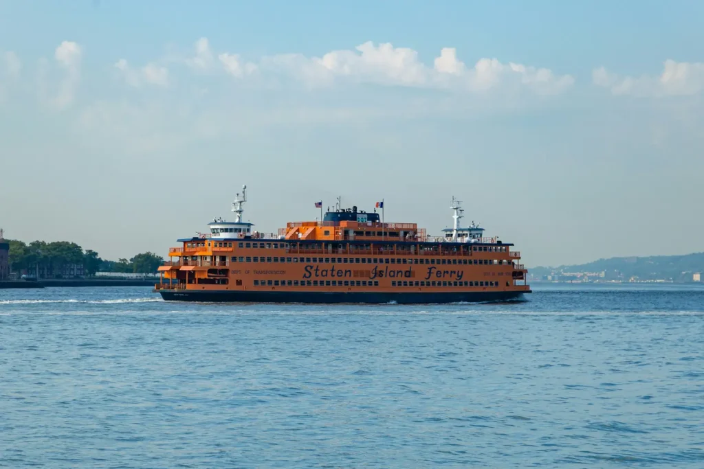 Staten Island Ferry: The Free Ride Past the Statue of Liberty 1 An orange Staten Island Ferry boat crossing New York Harbor on a clear day