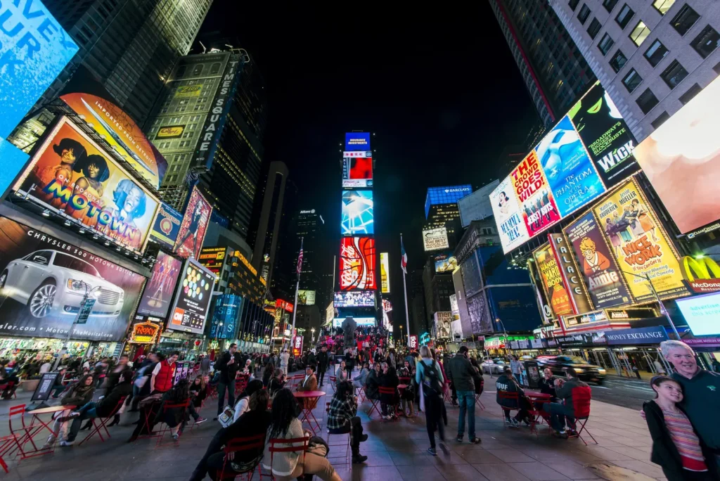 Times Square: Where It Is, What Is Worth Seeing, and How to Do It at Night 1 Times Square at night looking north toward the Red Steps and TKTS booth, with Broadway billboards above the pedestrian plaza